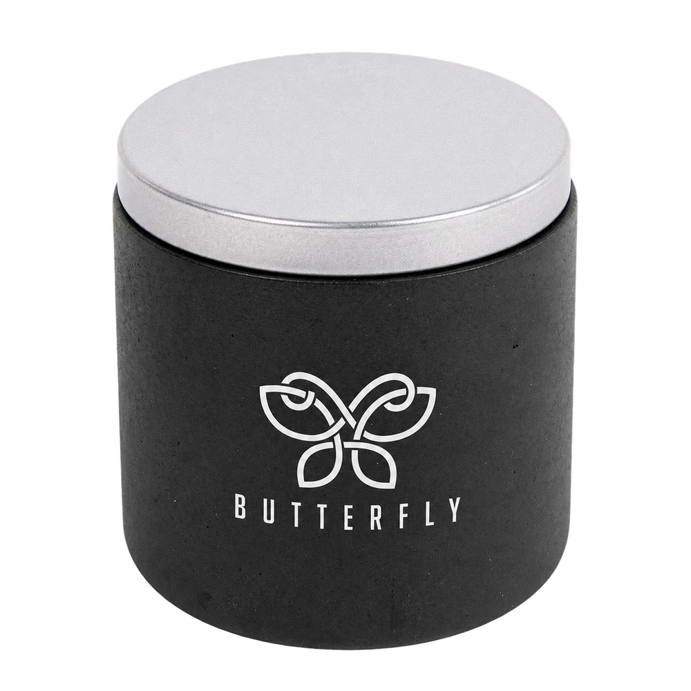 Black Cali Clay cement candle with a silver optional lid and white Butterfly sample imprint.