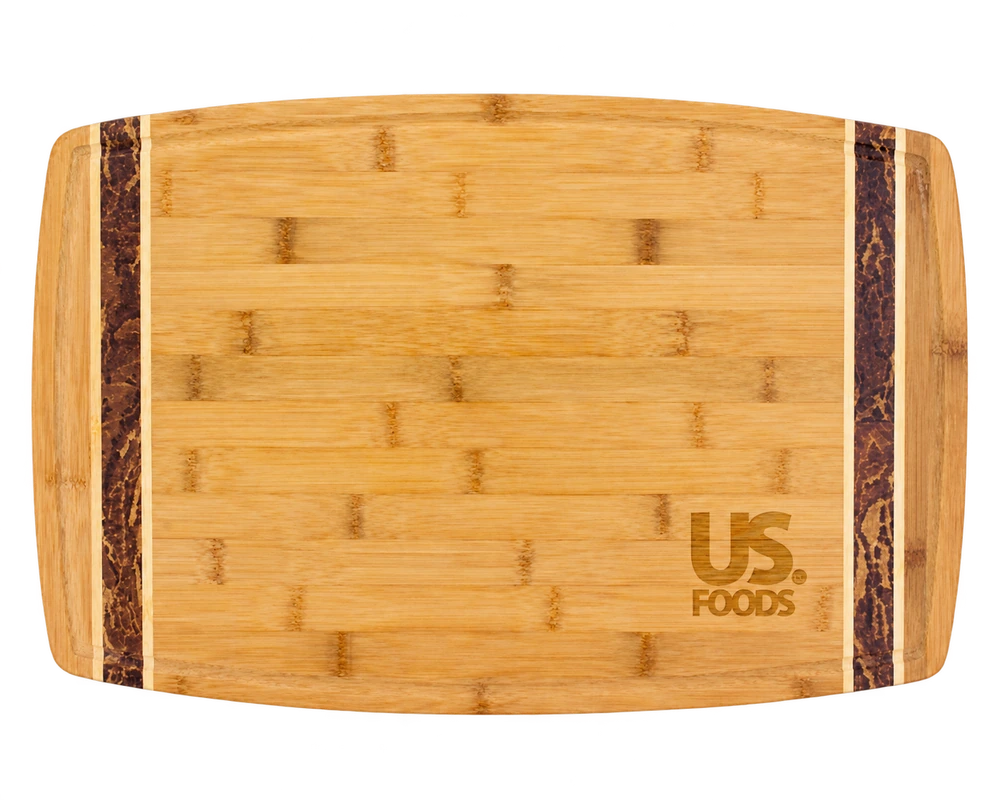 Marbled Look Bamboo Cutting Board with two dark bamboo inlays and a US Foods sample engraving at the lower right.